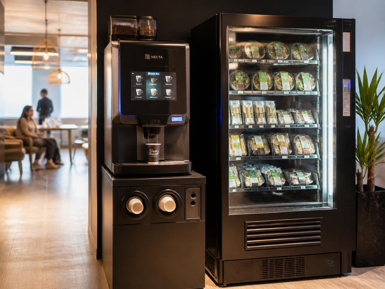 Coffee vending machine dispensing a hot coffee beside a refrigerated fresh food machine